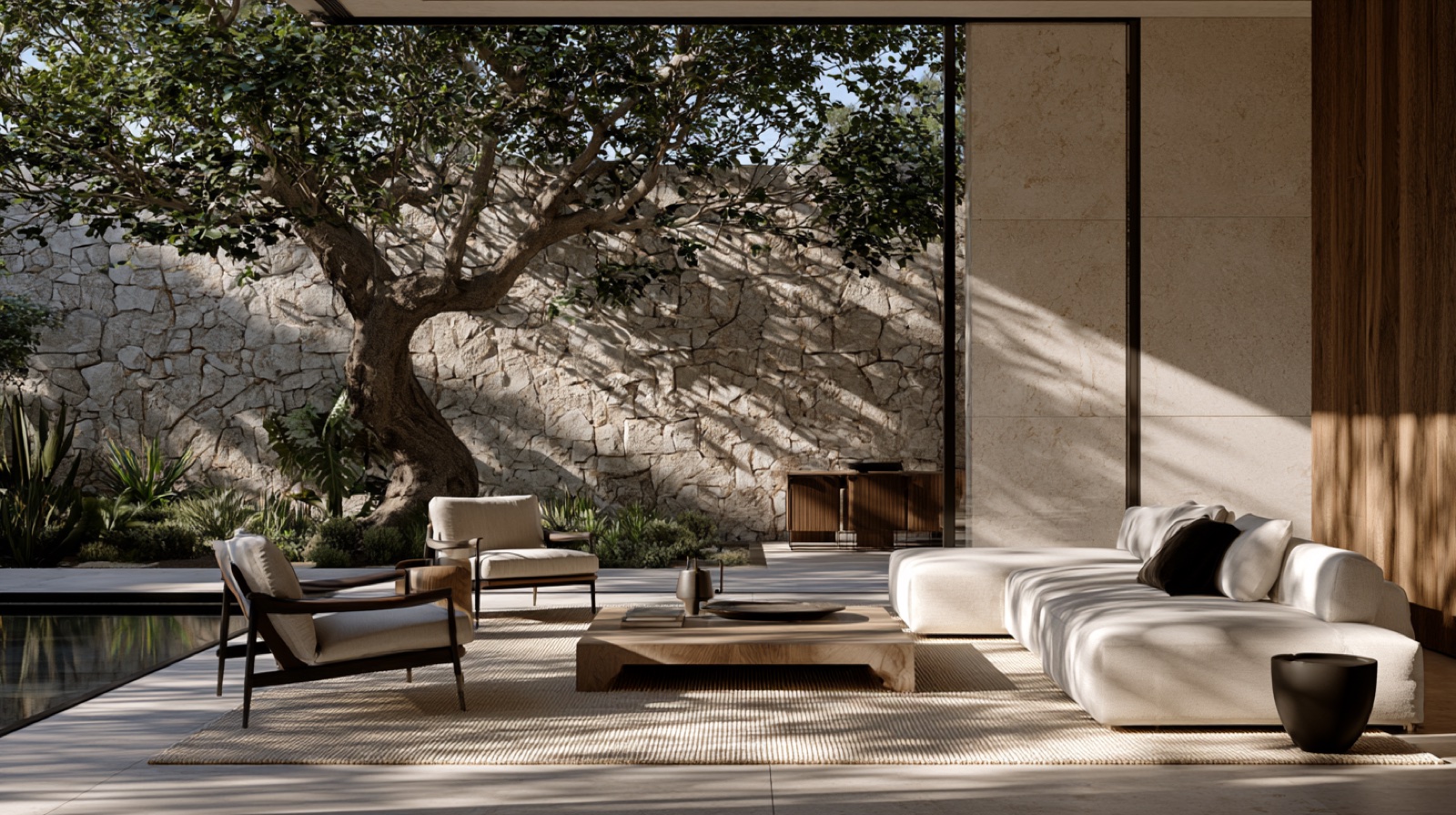 An indoor-outdoor terrace opening to a walled courtyard